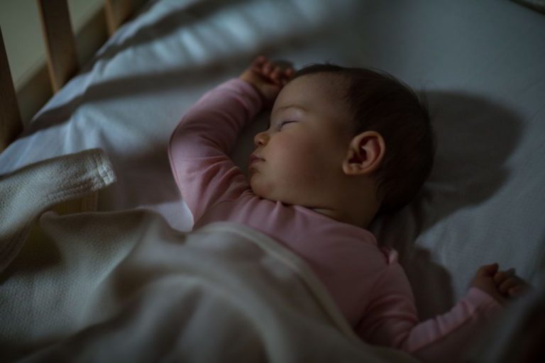 how to help baby sleep tightly through the night