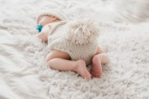 why do babies sleep with their butts in the air