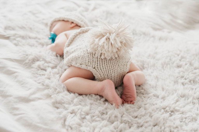 why do babies sleep with their butts in the air